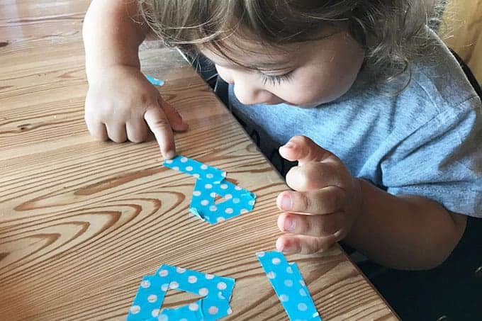 https://www.yummytoddlerfood.com/wp-content/uploads/2018/05/toddler-with-washi-tape.jpg