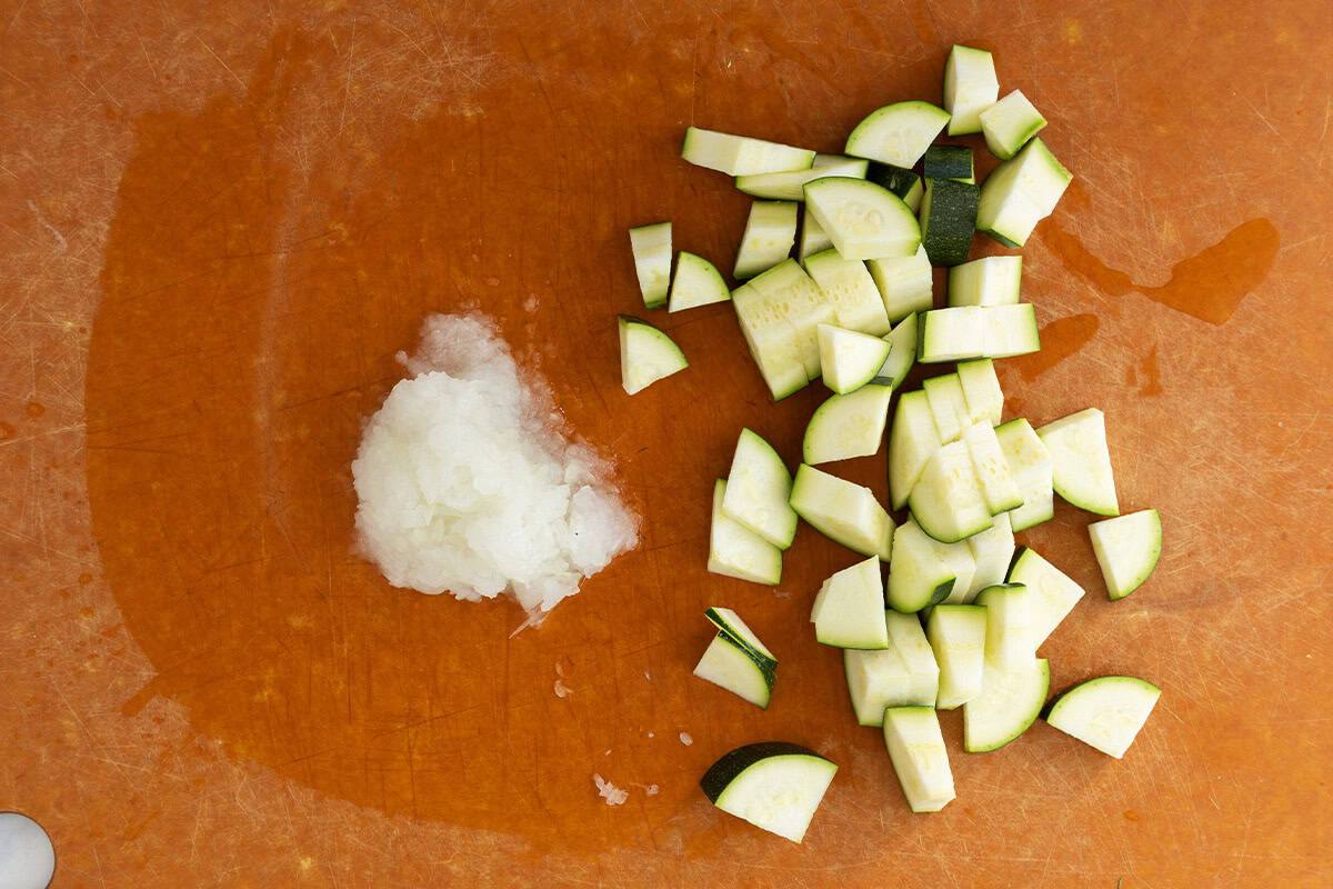 Zucchini on cutting board for baked risotto.