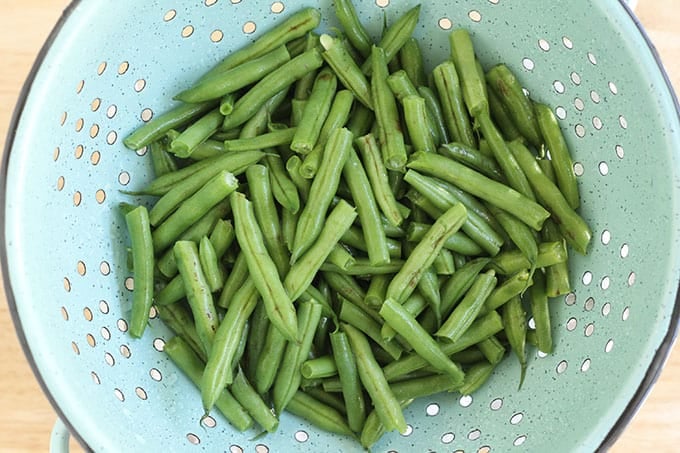 Green beans in strainer for sesame green beans. 