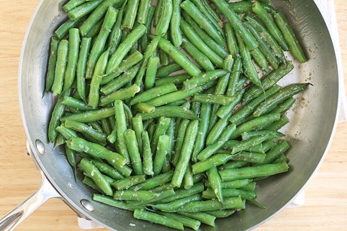 Green beans in frying pan for sesame green beans.