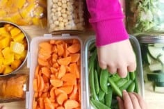 meal prepped veggies with kids hands