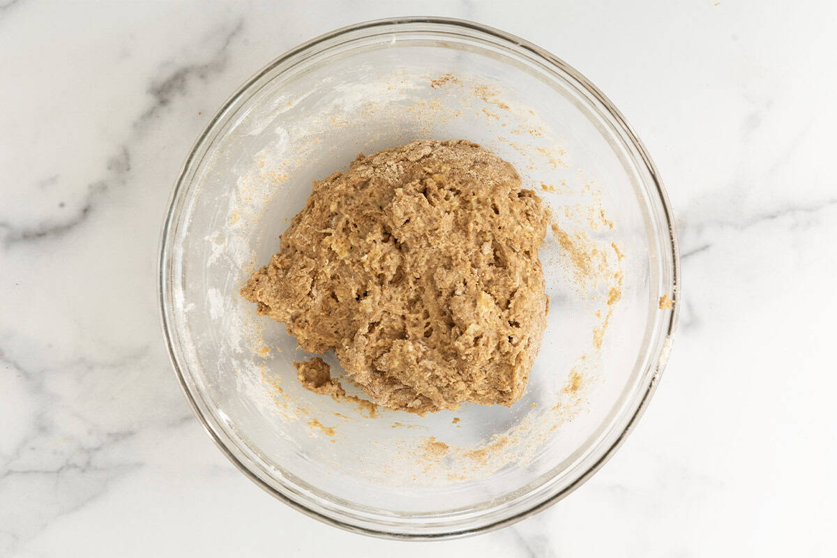 Batter for banana scones in glass bowl.