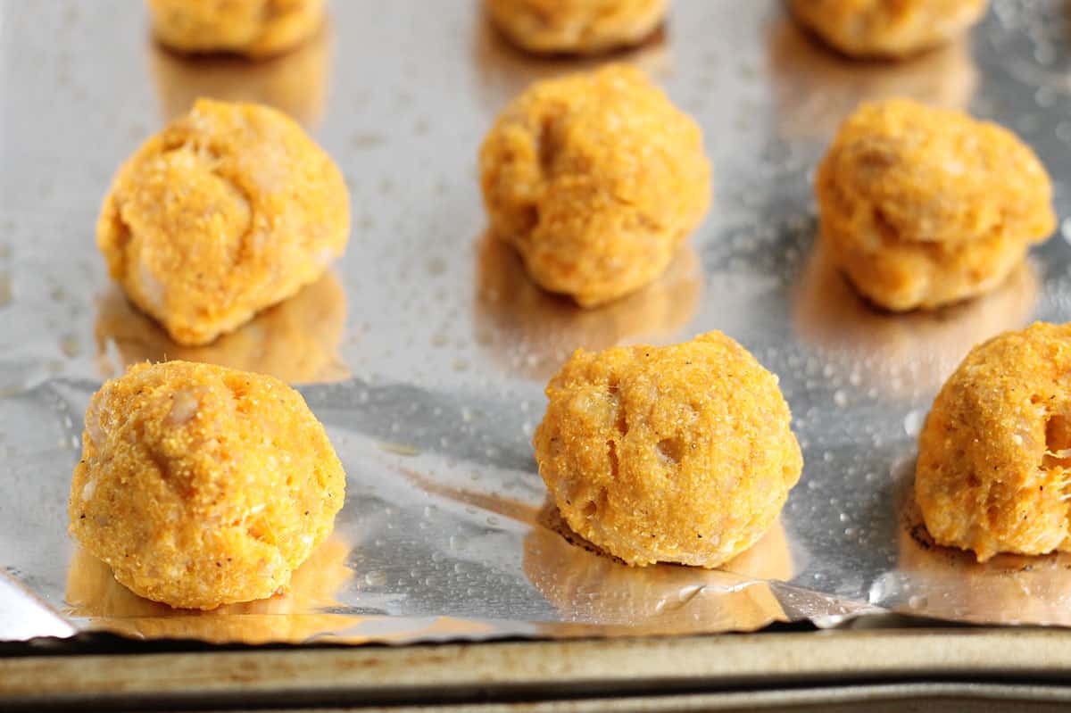 baked healthy chicken meatballs on baking pan.