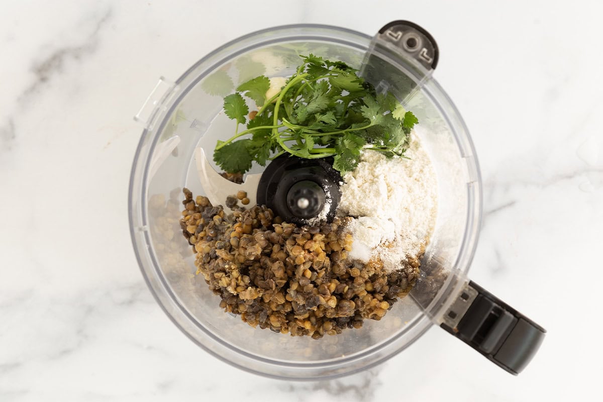 Lentil falafel in food processor before blending.