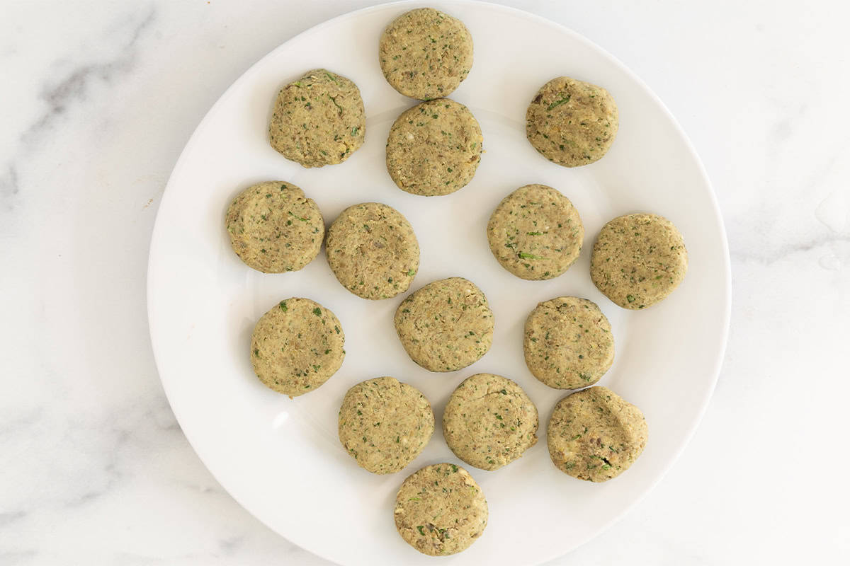 Lentil falafel on plate before frying.