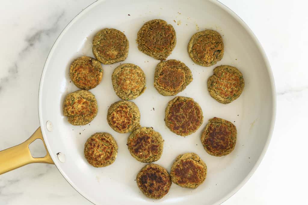 Lentil falafel on plate after frying.