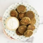 Lentil falafel on plate with dip.