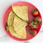 spinach quesadillas on pink plate.