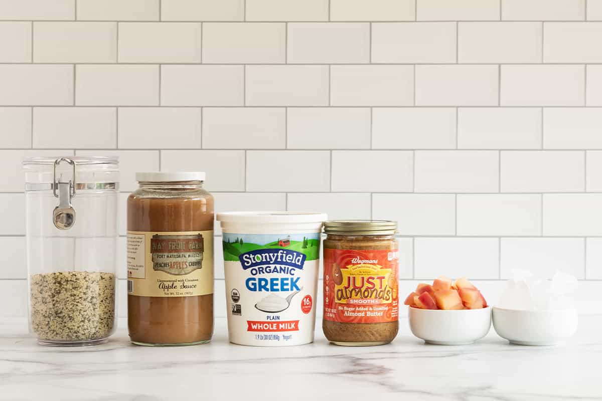 Ingredients for apple smoothie on countertop.