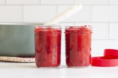 Cranberry orange sauce in two glass jars.