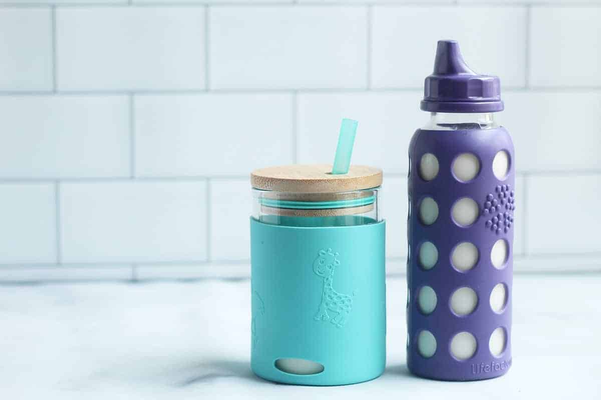 https://www.yummytoddlerfood.com/wp-content/uploads/2021/03/milk-in-blue-and-purple-sippy-cups.jpg