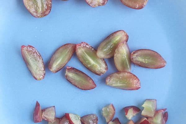 How To Serve Grapes To Kids To Reduce Choking Risks   Quartered Grapes On Blue Plate 600x400 