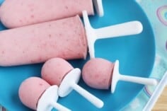 mini strawberry popsicles on plate