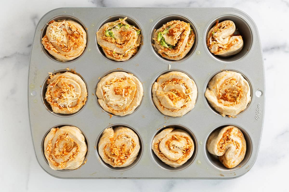 pizza rolls in pan ready to bake.