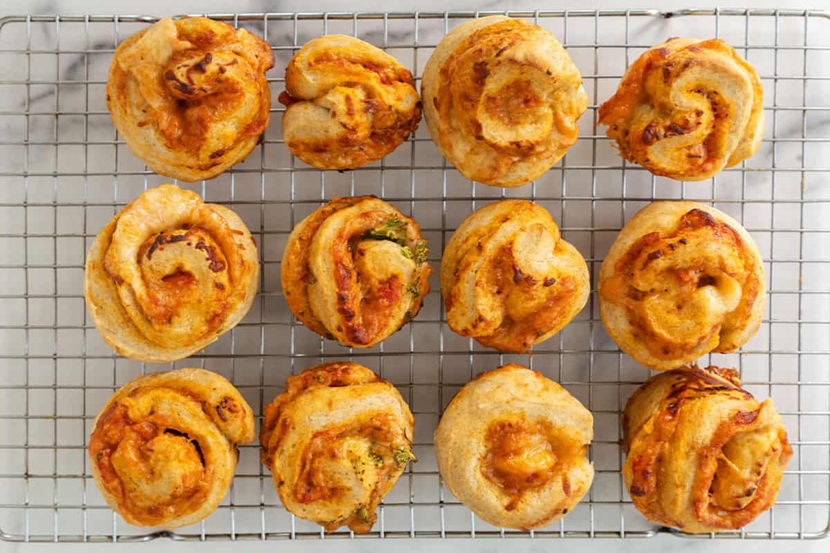 pizza rolls on wire rack on counter.