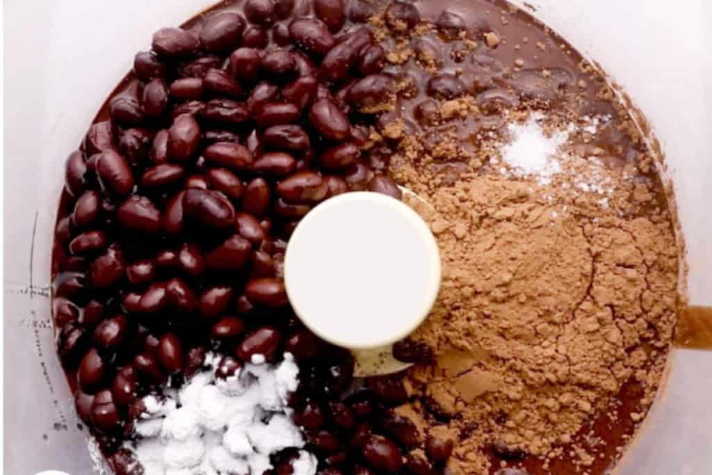 Ingredients for black bean brownies in food processor.