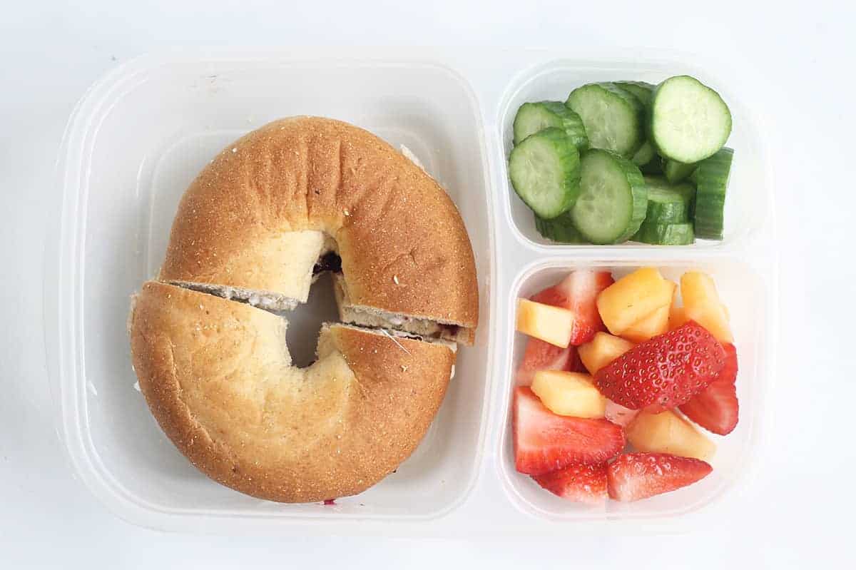 Bagel sandwich with fruit and veggies for a vegetarian lunch idea