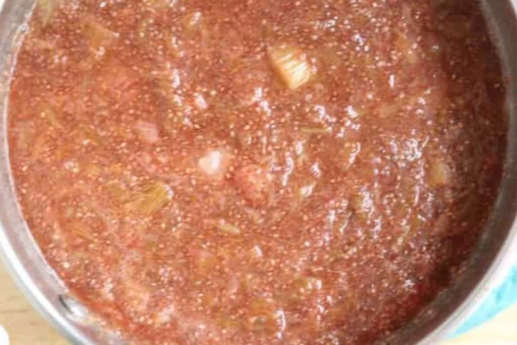 Strawberry Rhubarb jam with chia seeds in pot.