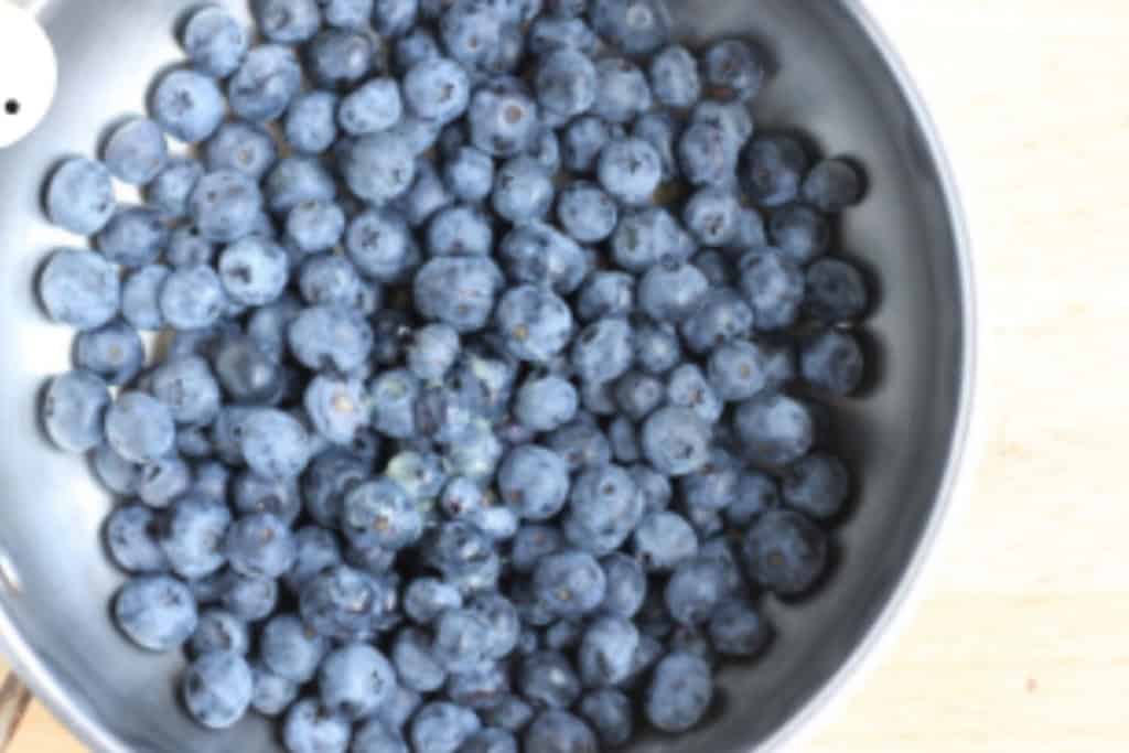 Blueberries in pan for blueberry jam.