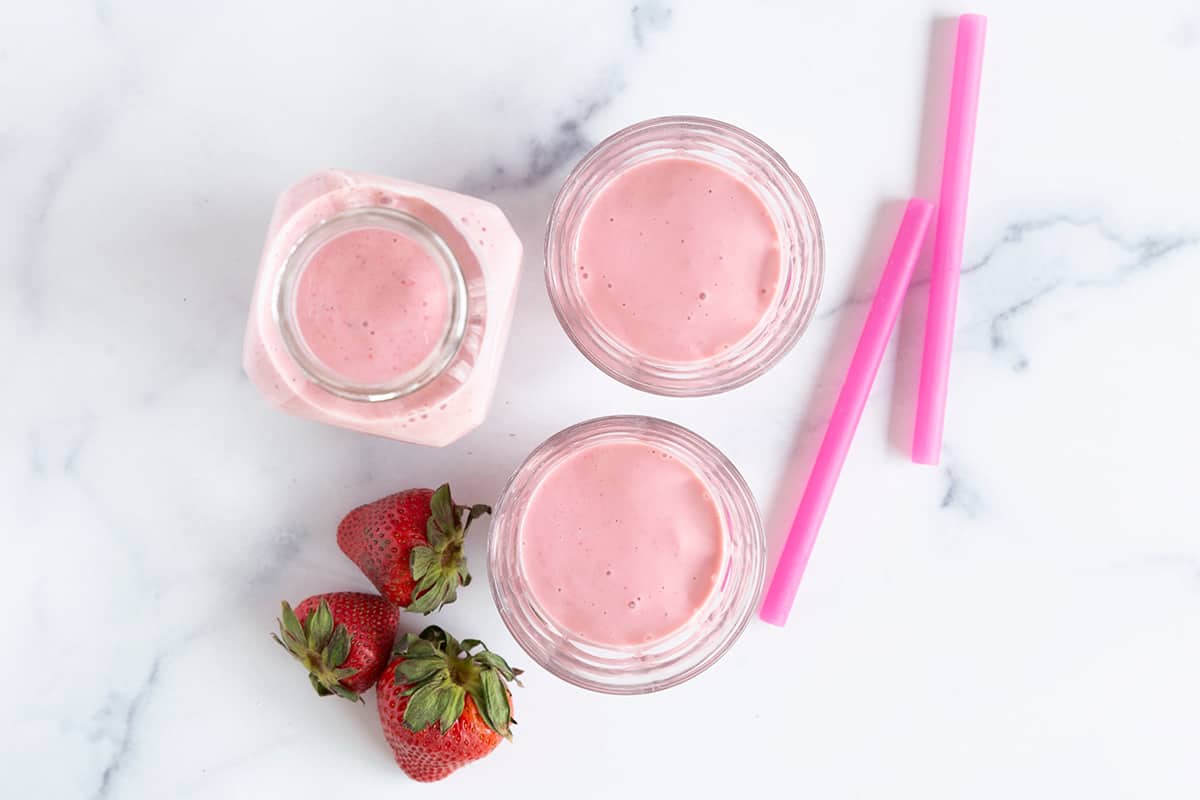 https://www.yummytoddlerfood.com/wp-content/uploads/2022/07/strawberry-smoothie-in-cups-on-counter.jpg