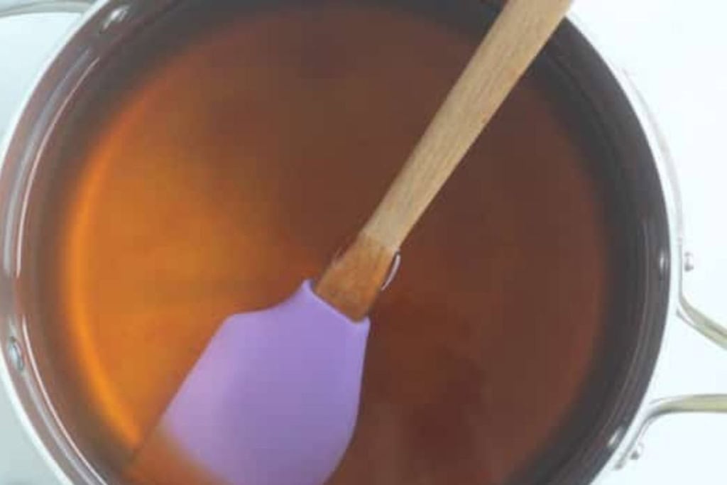 Honey syrup in large pot for canned peaches.