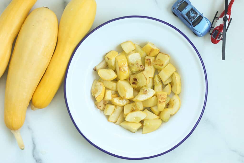 sauteed yellow squash in bowl.