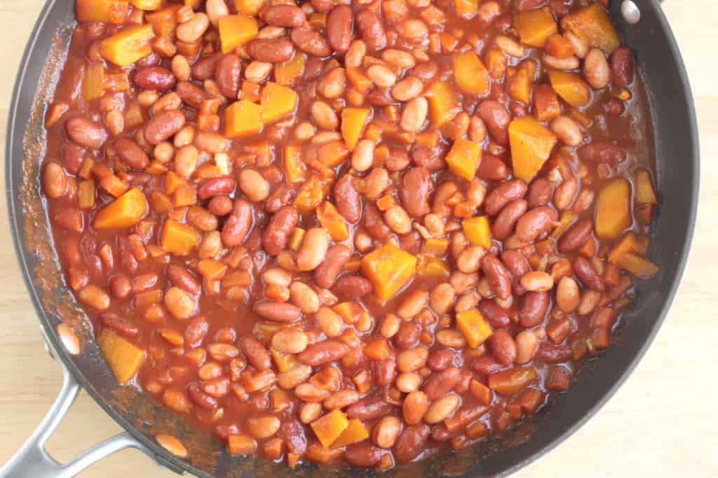 Beans with veggies in pan for chili mac.