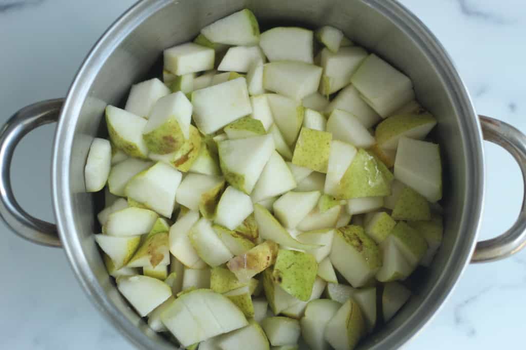 Diced pears in pot before cooking for pear sauce.