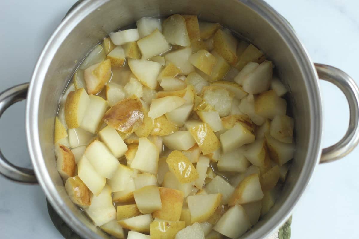 Diced pears in pot for pear sauce.
