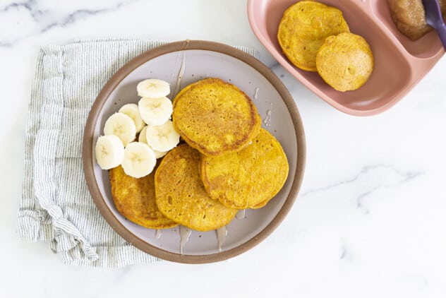 pumpkin pancakes on plate with banana slices