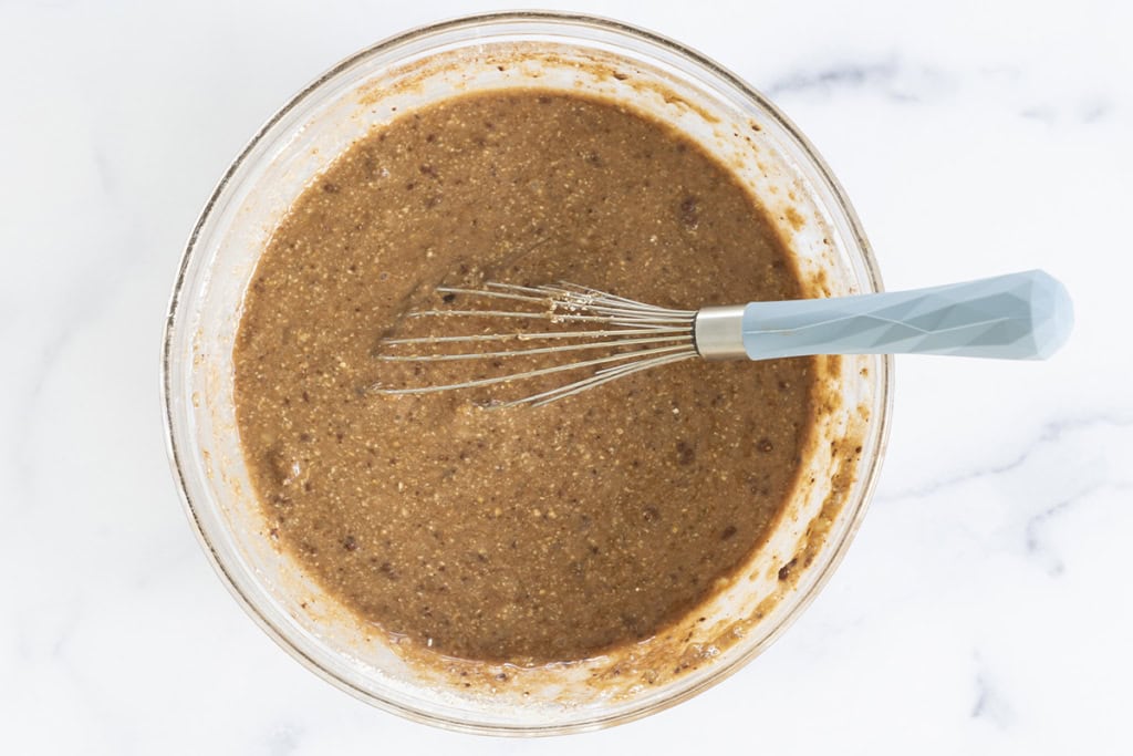 Batter for healthy brownies in glass bowl.