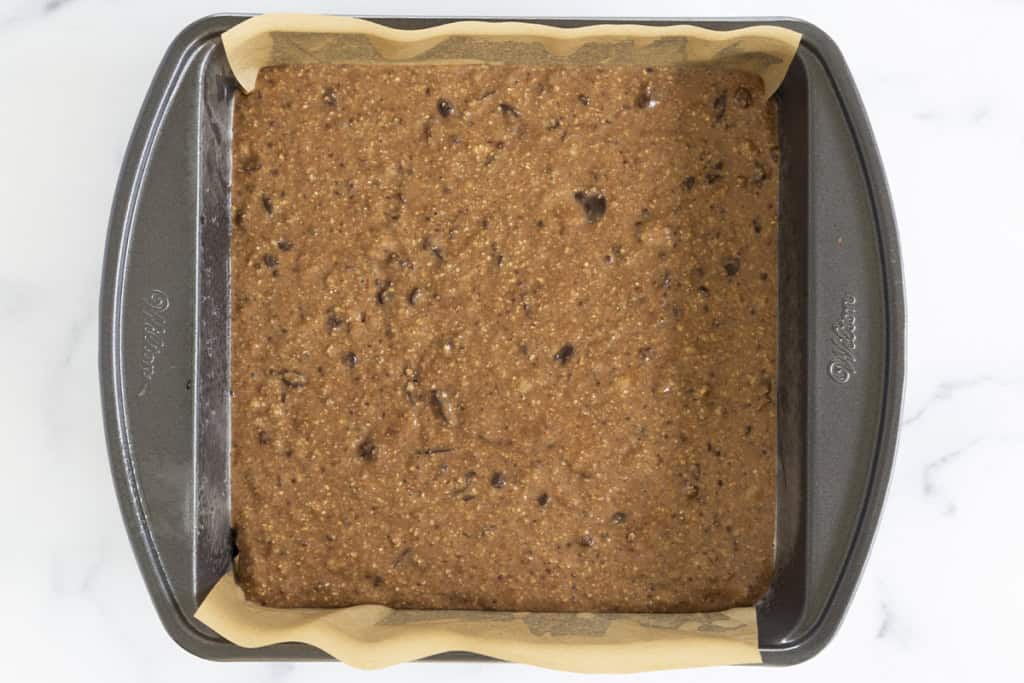 Healthy brownies in baking pan before baking.