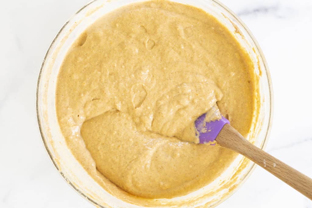 pumpkin pancake batter stirred together in a bowl.