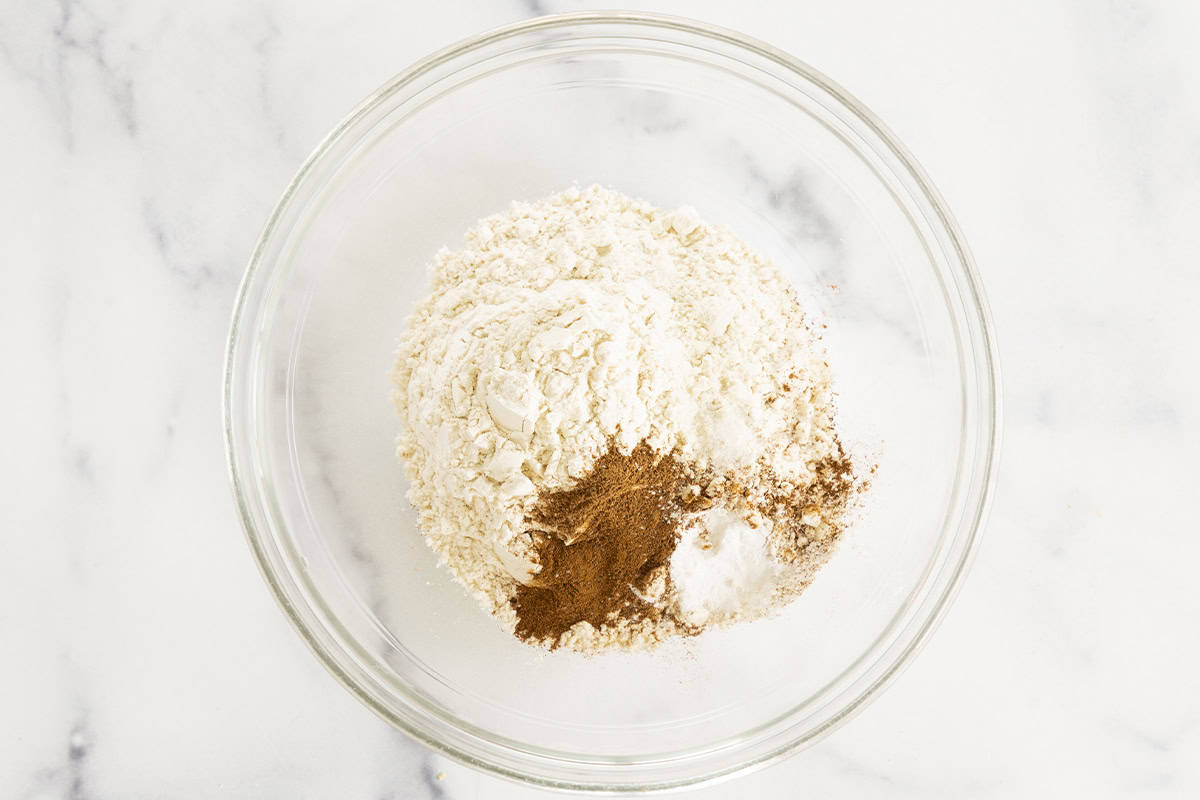 Dry ingredients for thanksgiving cookies in glass bowl. 