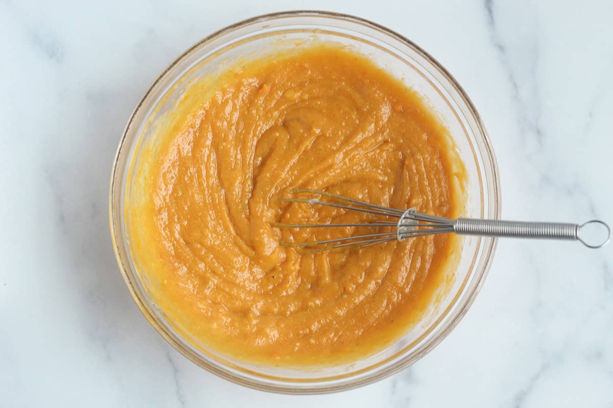 Wet ingredients for sweet potato brownies in glass bowl. 