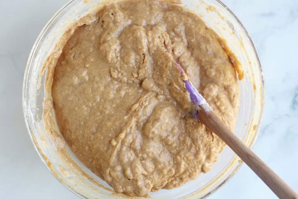 Batter for sweet potato muffins in glass bowl.