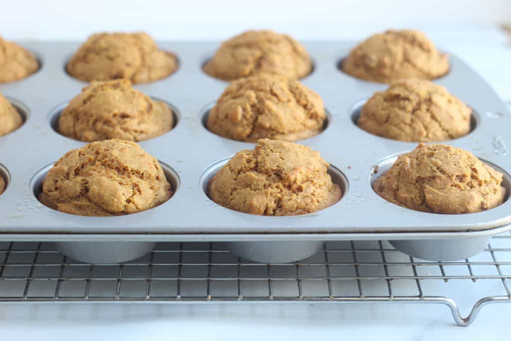 Sweet potato muffins in muffin pan after baking.