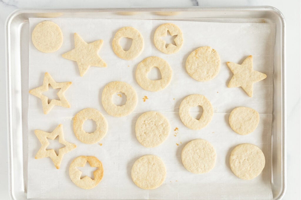 baked cookies for jam cookies on cookie sheet pan.