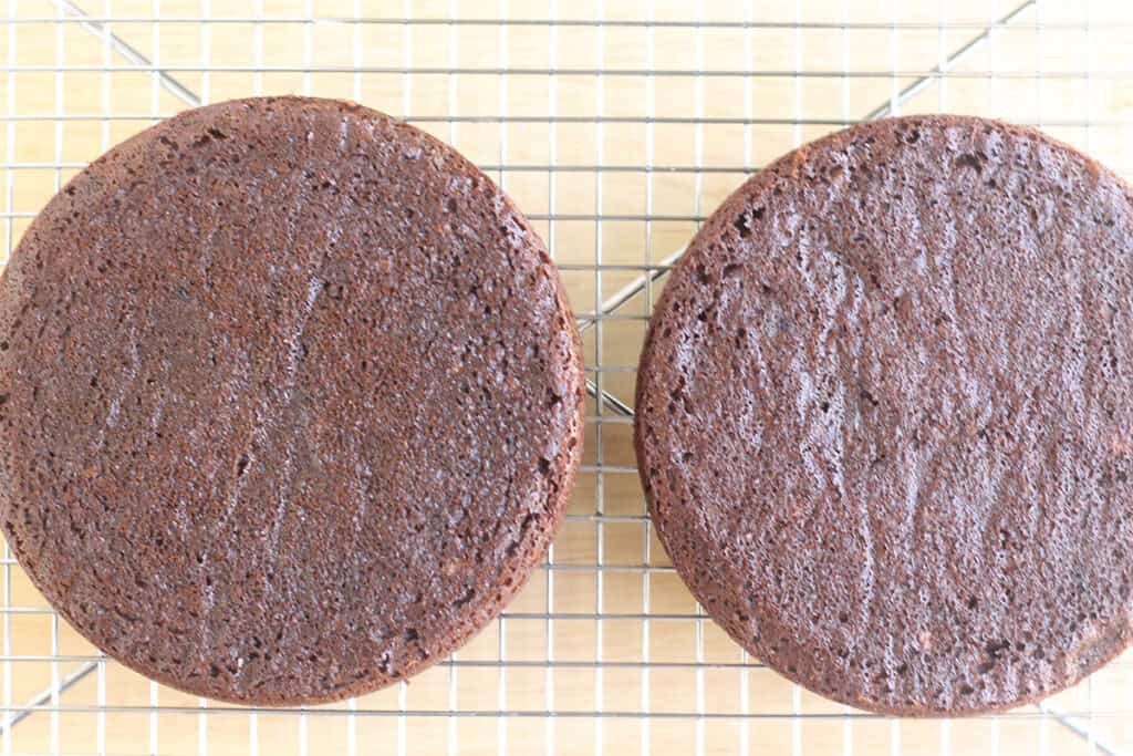 baked healthy chocolate cake cooling on wire rack.