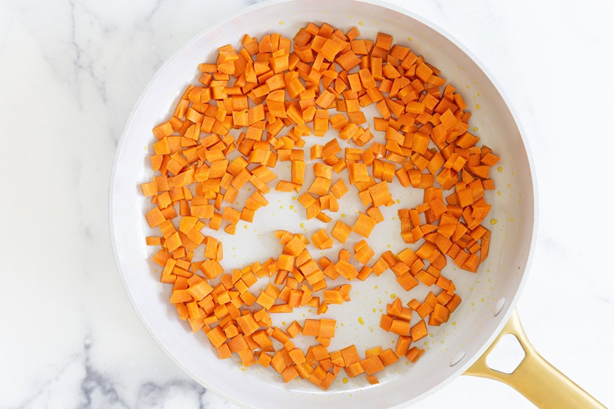 Carrots in pot for chicken and stars soup. 