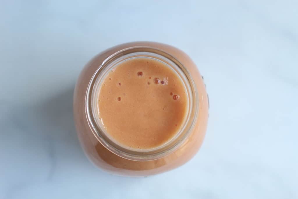 Peach sauce in mason jar.