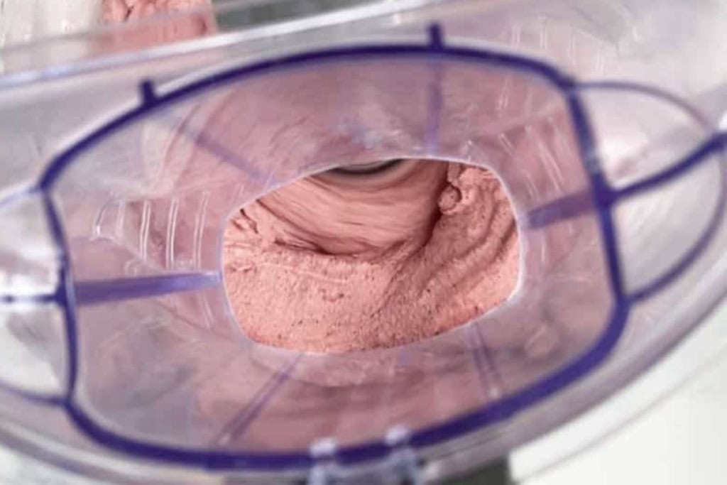 Blueberry ice cream in food processor. 