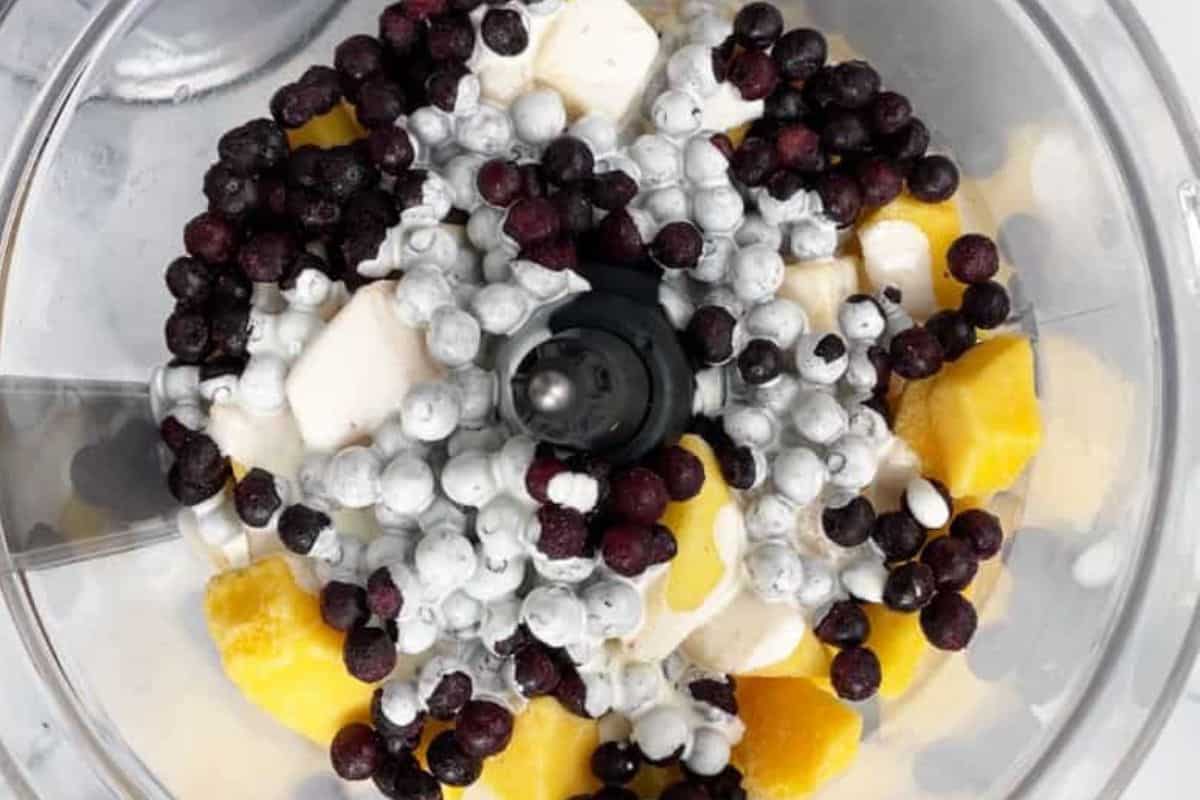 Fruit in food processor for blueberry ice cream. 