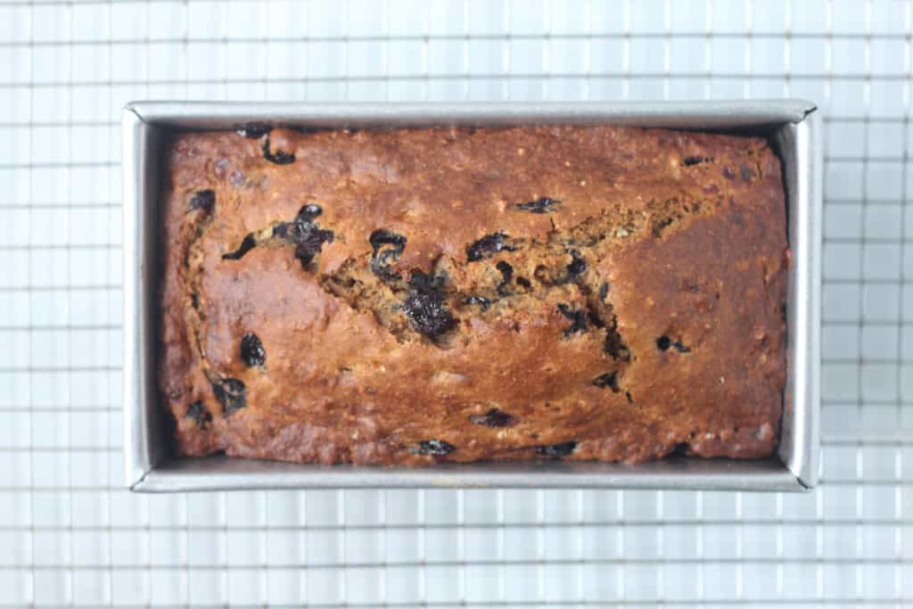 Blueberry banana bread in baking pan after baking.