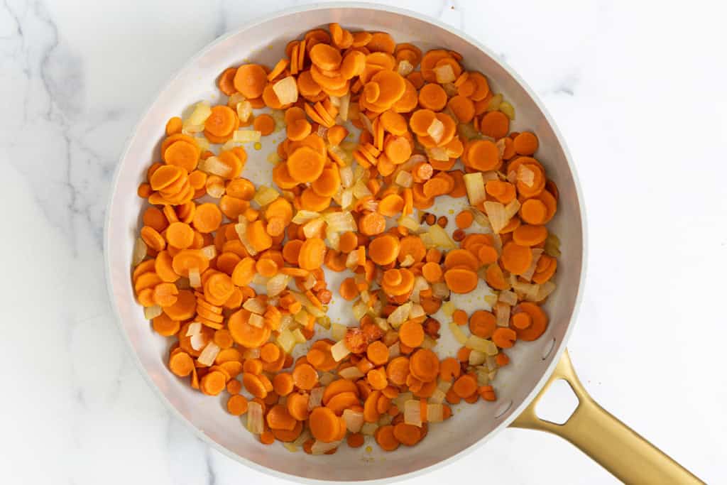 Carrots in pan for carrot soup.