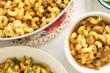 Hamburger helper in various dishes and pan.