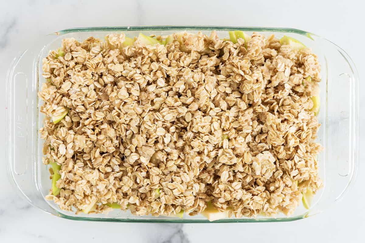 Apple crisp in pan before baking.