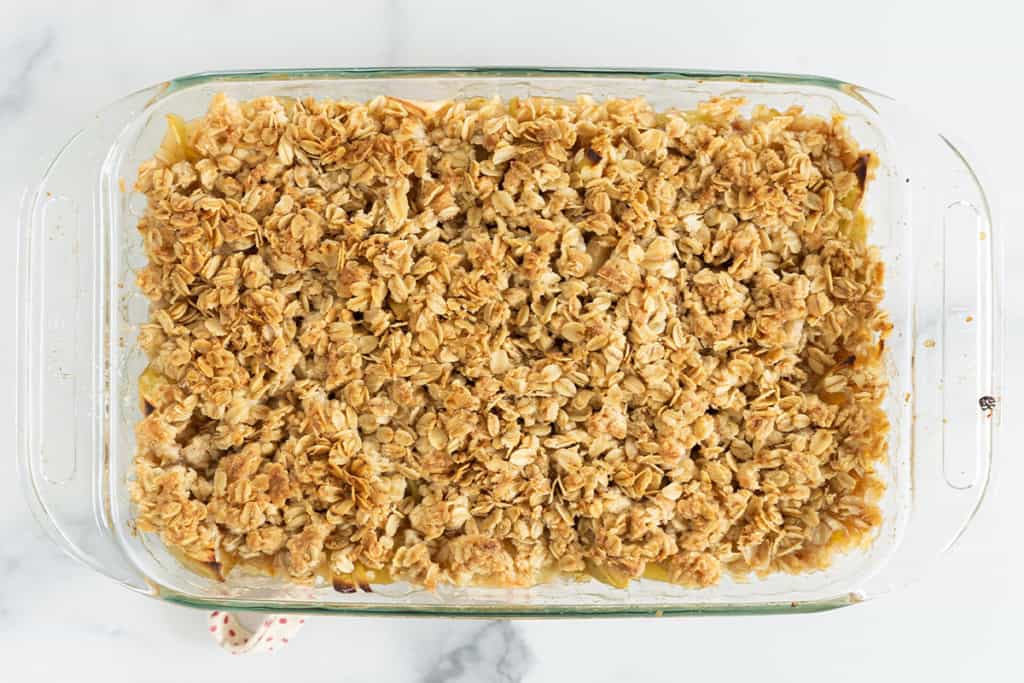 Apple crisp after baking in pan.