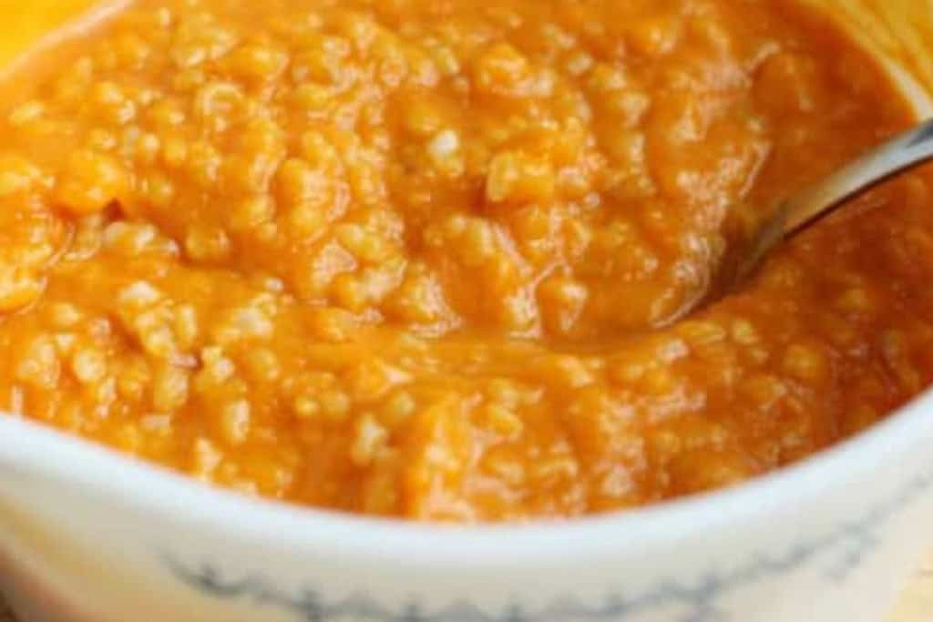 Butternut squash risotto in pot.