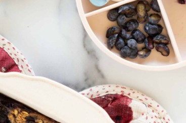 Blueberry baked oatmeal on kids plate and in pan.